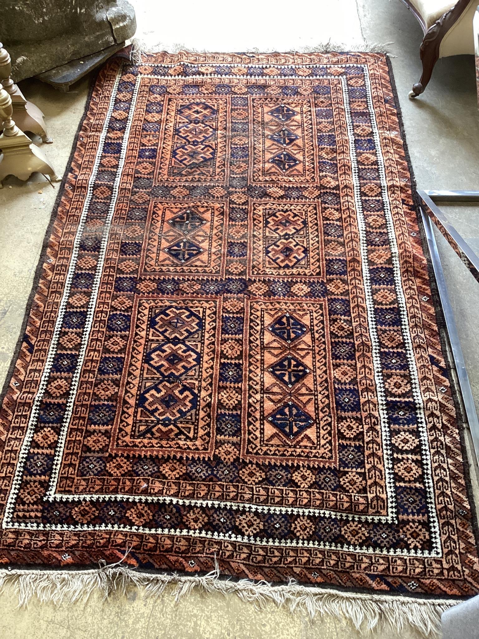 A Belouch blue ground geometric rug 240cm x 140cm